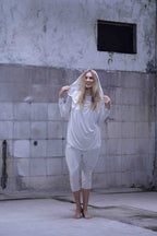 Jersey over draped sweater