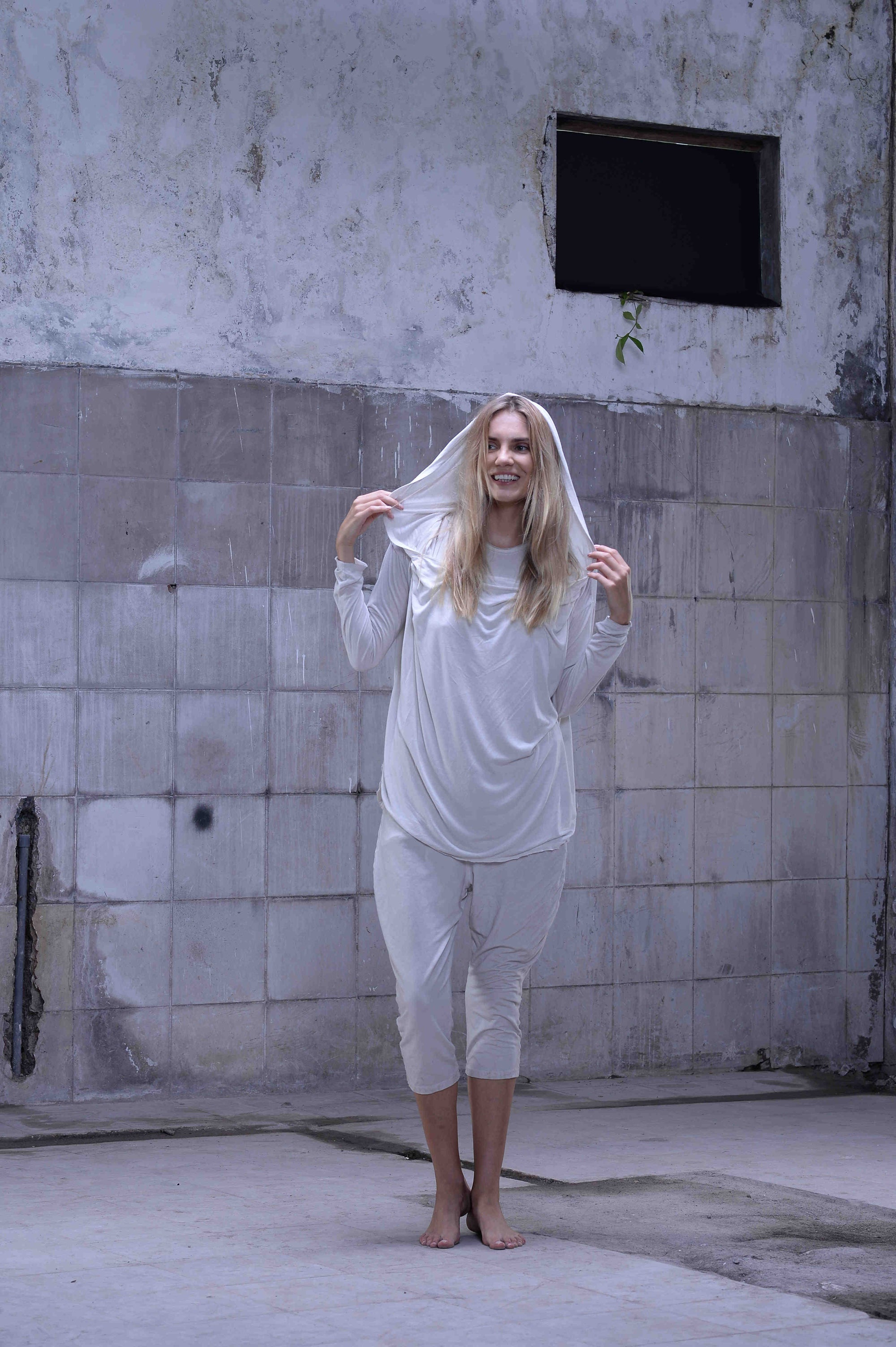 Jersey over draped sweater